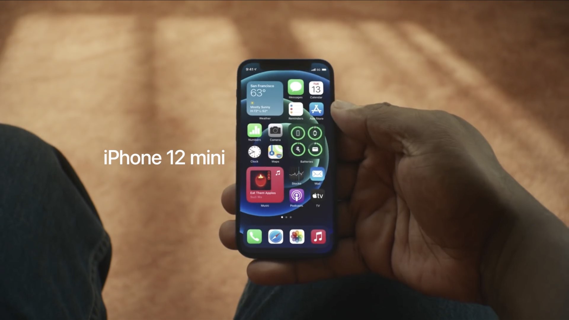 A still from an Apple ad showing an iPhone 12 mini in a user's hands